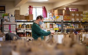 Photo of a person working in a food bank