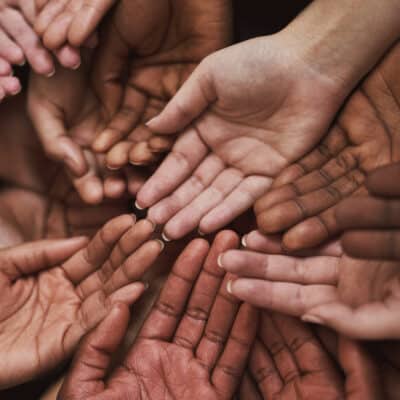 multiple hands being held out