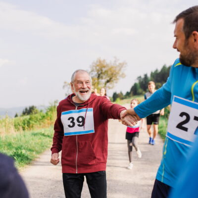 "Runners sharing a joyful moment during a charity race."